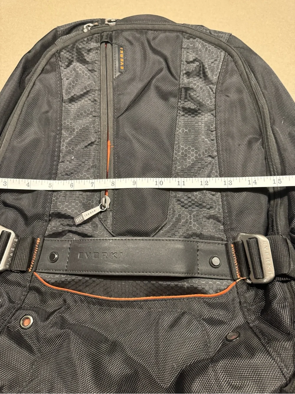 Black Men's Travel Backpack with Orange Accents Everki large laptop bag.